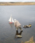 Stephen reaches out to bring in Loughie's boat... Photo: RC